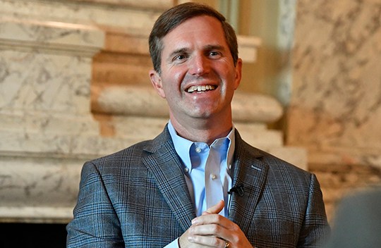 Kentucky Governor Andy Beshear reacts to a question sits for his first interview following his re-election in the Kentucky Governors race in the State Reception Room at the Kentucky State Capitol Frankfort, Ky., Wednesday, Nov. 8, 2023. Beshear defeated Attorney General Daniel Cameron to retain the Governorship. (AP Photo/Timothy D. Easley)